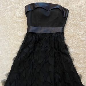 Black strapless fit and flare dress.